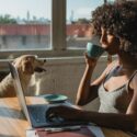 What Does Gen Z Want At Work? A Woman Drinking Coffee At Hr Computer.
